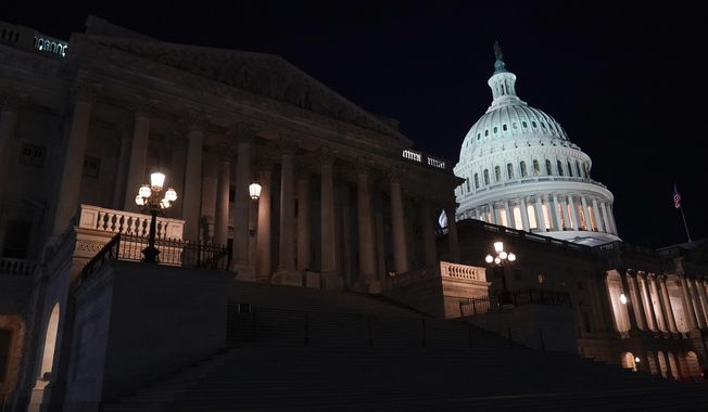 Lights illuminate the Capitol after House Speaker Kevin McCarthy of Calif., announced that he and President Joe Biden had reached an &quot;agreement in principle&quot; to resolve the looming debt crisis on Saturday, May 27, 2023, on Capitol Hill in Washington. (AP Photo/Patrick Semansky)