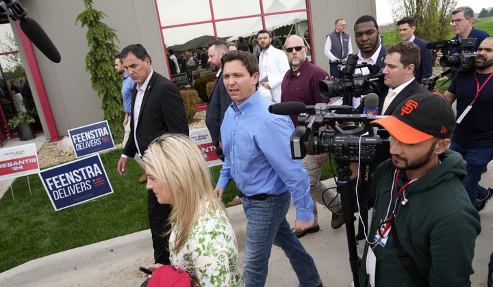 Florida Gov. Ron DeSantis, center, leaves a fundraising picnic for Rep. Randy Feenstra, R-Iowa, May 13, 2023, in Sioux Center, Iowa. (AP Photo/Charlie Neibergall, File)