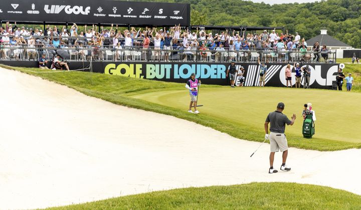 Harold Varner III of RangeGoats GC acknowledges the crowd after his holes out for birdie during the final round of LIV Golf DC at the Trump National Golf Club Washington DC on Sunday, May 28, 2023 in Sterling, Virginia. (Photo by Mike Stobe/LIV Golf via AP)