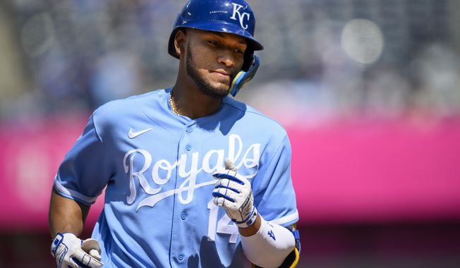 Kansas City Royals&#x27; Edward Olivares rounds the bases after hitting a home run against the Washington Nationals during the eighth inning of a baseball game, Sunday, May 28, 2023, in Kansas City, Mo. (AP Photo/Reed Hoffmann)