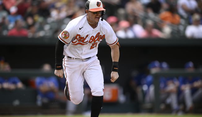 Baltimore Orioles&#x27; Austin Hays reacts as he runs to first on his RBI single during the eighth inning of a baseball game against the Texas Rangers, Sunday, May 28, 2023, in Baltimore. The Orioles won 3-2. (AP Photo/Nick Wass)