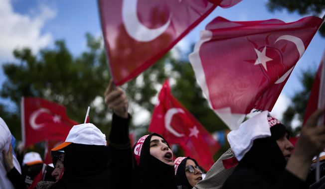 Supporters of Turkish President and People&#x27;s Alliance&#x27;s presidential candidate Recep Tayyip Erdogan, attend an election campaign rally in Istanbul, Turkey, Saturday, May 27, 2023. (AP Photo/Khalil Hamra)