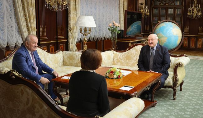 In this handout photo released by Belarusian Presidential Press Office, Belarusian President Alexander Lukashenko, right, speaks with the head of Russia&#x27;s Central Bank Elvira Nabiullina, centre, in Minsk, Belarus, Monday, May 29, 2023. At left is Pavel Kallaur, chairman of the National Bank of the Republic of Belarus. (Belarusian Presidential Press Office via AP)