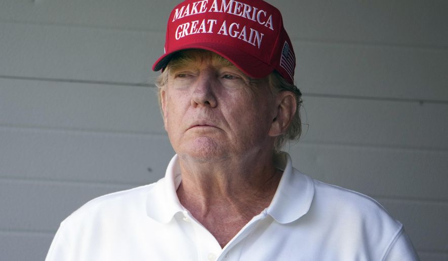 Former President Donald Trump watches the first round of the LIV Golf Tournament at Trump National Golf Club, Friday, May 26, 2023, in Sterling, Va. When Republican Sen. Tim Scott launched his campaign for the White House last week, Trump welcomed his new competitor with open arms. There were no accusations of disloyalty or nasty nicknames from the GOP front-runner like the barrage he unleashed when Florida Gov. Ron DeSantis, considered his leading rival, joined the race two days later with a bungled Twitter announcement. (AP Photo/Alex Brandon) **FILE**