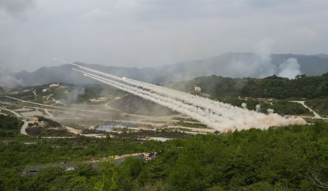 FILE - South Korean army&#x27;s multiple launch rocket systems fire rockets during a South Korea-U.S. joint military drills at Seungjin Fire Training Field in Pocheon, South Korea, Thursday, May 25, 2023. North Korea on Tuesday, May 30, confirmed plans to launch its first military spy satellite in June and described such capacities as crucial for monitoring the United States&#x27; &quot;reckless&quot; military exercises with rival South Korea. (AP Photo/Ahn Young-joon, File)