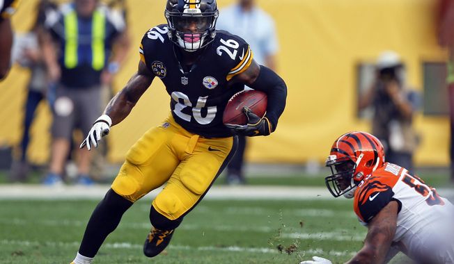 Pittsburgh Steelers running back Le&#x27;Veon Bell (26) carries the ball during an NFL football game against the Cincinnati Bengals in Pittsburgh on Oct. 22, 2017. The former Pittsburgh Steelers and New York Jets running back said on a podcast, Friday, May 26, 2023, he smoked marijuana before playing some NFL games during his career. (AP Photo/Keith Srakocic, File)