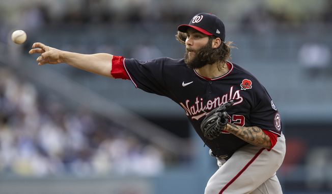 Washington Nationals starting pitcher Trevor Williams throws during the first inning of a baseball game against the Los Angeles Dodgers in Los Angeles, Monday, May 29, 2023. (AP Photo/Kyusung Gong)