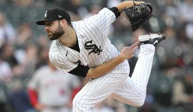 Chicago White Sox starting pitcher Lucas Giolito follows through during the first inning of the team&#x27;s baseball game against the Los Angeles Angels on Tuesday, May 30, 2023, in Chicago. (AP Photo/Charles Rex Arbogast)