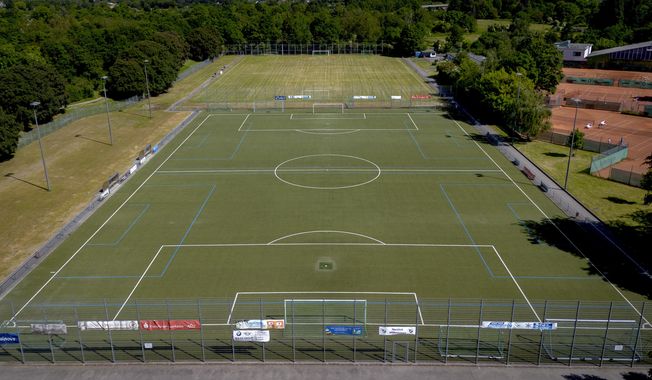 Pitches of a soccer club is pictured in Frankfurt, Germany, Tuesday, May 30, 2023. A 15-year-old soccer player remained hospitalized Tuesday with life-threatening brain injuries after being struck by an opposing player in a post-match fight during an international youth tournament in Germany. A 16-year-old from a French team was jailed pending further investigation by a judge in Frankfurt, where the match with a team from Berlin took place on Sunday. (AP Photo/Michael Probst)