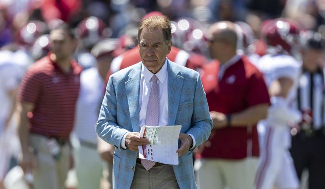 Alabama head coach Nick Saban paces as his team warms up before Alabama&#x27;s A-Day NCAA college football scrimmage, Saturday, April 22, 2023, in Tuscaloosa, Ala. Saban says college football is not a business that operates like the NFL and warned that without more uniform rules on player compensation only the biggest spenders will compete for championships. (AP Photo/Vasha Hunt) **FILE**