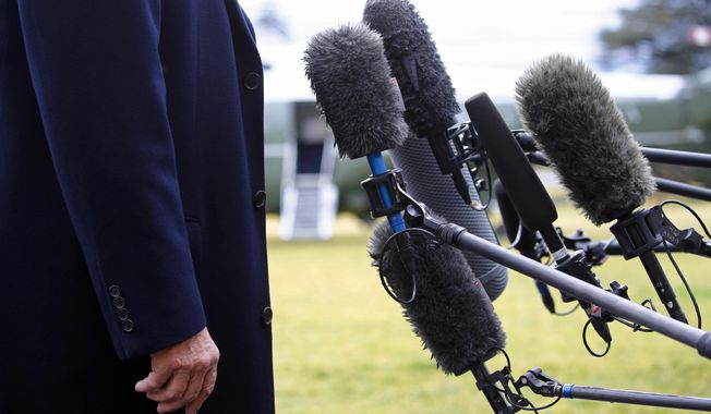 President Trump stands in front of microphones as he speaks to members of the news media on the South Lawn of the White House in Washington, Friday, Feb. 7, 2020, before boarding Marine One. (AP Photo/Patrick Semansky, File)