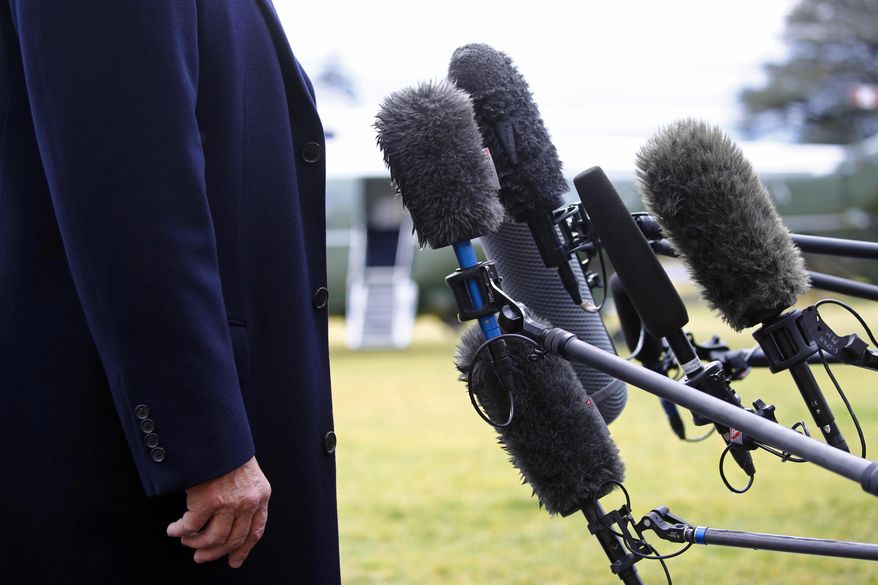 President Trump stands in front of microphones as he speaks to members of the news media on the South Lawn of the White House in Washington, Friday, Feb. 7, 2020, before boarding Marine One. (AP Photo/Patrick Semansky, File)