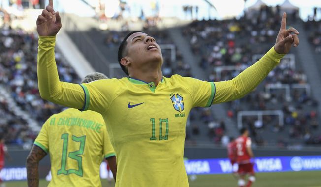 Brazil&#x27;s Matheus Martins celebrates after scoring his side&#x27;s third goal against Tunisia during a FIFA U-20 World Cup round of 16 soccer match at La Plata Stadium in La Plata, Argentina, Wednesday, May 31, 2023. (AP Photo/Gustavo Garello)
