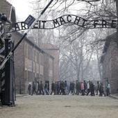 People visit the Nazi concentration camp Auschwitz-Birkenau in Oswiecim, Poland, on Friday, Feb. 15, 2019. The Auschwitz-Birkenau memorial museum has denounced a political spot by Poland&#x27;s ruling party that uses the theme of the Nazi German extermination camp to discourage participation in an upcoming anti-government march. (AP Photo/Michael Sohn, File)