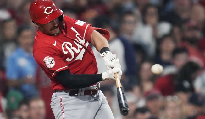 Cincinnati Reds&#x27; Spencer Steer connects for a two-run home run during the seventh inning of the team&#x27;s baseball game against the Boston Red Sox at Fenway Park, Wednesday, May 31, 2023, in Boston. (AP Photo/Charles Krupa)