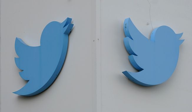 Twitter logos hang outside the company&#x27;s offices in San Francisco, Monday, Dec. 19, 2022. Twitter may now be worth one-third of what Elon Musk paid for the social media platform just seven months ago. Financial services company Fidelity has reduced the market value of its equity stake in Twitter for a third time, now putting it at $6.55 billion. (AP Photo/Jeff Chiu, File)