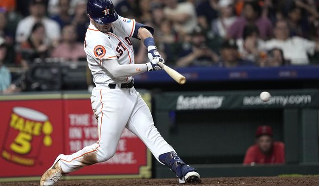 Houston Astros&#x27; Alex Bregman hits a two-run single against the Los Angeles Angels during the fifth inning of a baseball game Thursday, June 1, 2023, in Houston. (AP Photo/David J. Phillip)