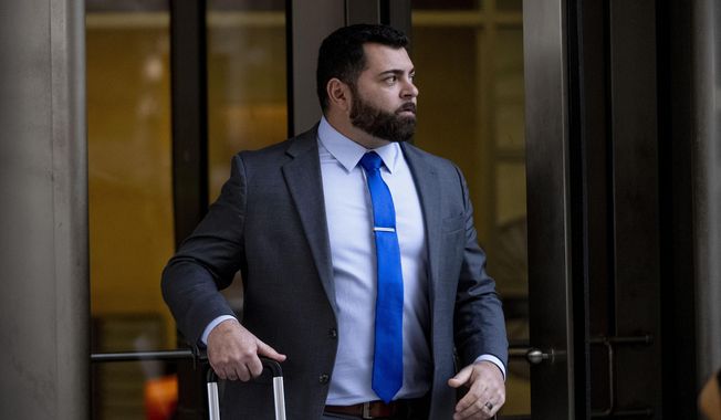 Roberto Minuta of Prosper, Texas, leaves federal court in Washington, Jan. 23, 2023. Minuta, a member of the far-right Oath Keepers extremist group who was part of a security detail for former President Donald Trump&#x27;s longtime adviser Roger Stone before storming the U.S. Capitol, was sentenced on Thursday to more than four years in prison. (AP Photo/Andrew Harnik, File)