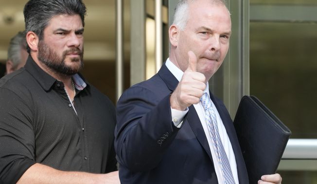 Michael McMahon gives photographers a thumbs up as he leaves Brooklyn Federal court, Wednesday, May 31, 2023, in New York. (AP Photo/Mary Altaffer)