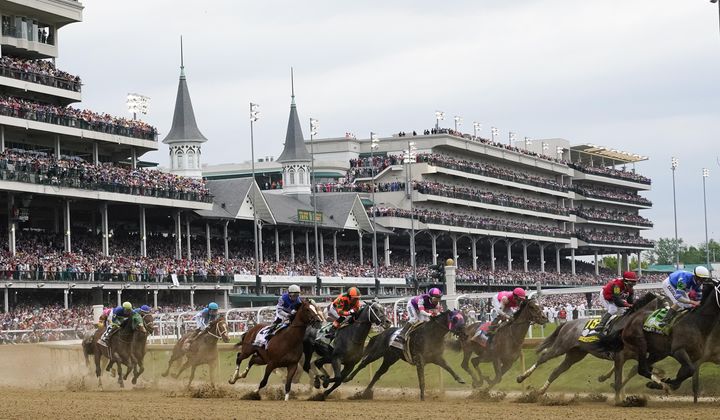 Javier Castellano, atop Mage, third from left, is seen behind with others behind the pack as they make the first turn while competing in the 149th running of the Kentucky Derby horse race at Churchill Downs Saturday, May 6, 2023, in Louisville, Ky. Churchill Downs will limit horses to four starts during a rolling eight-week period and impose ineligibility standards for continued poor performance in the wake of the recent deaths of 12 horses at the home of the Kentucky Derby. (AP Photo/Julio Cortez) **FILE**