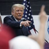 Former President Donald Trump visits with campaign volunteers at the Grimes Community Complex Park, Thursday, June 1, 2023, in Des Moines, Iowa. (AP Photo/Charlie Neibergall)