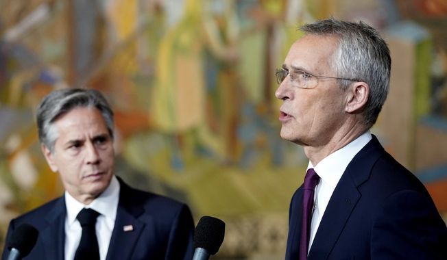 U.S. Secretary of State Antony Blinken, left, listens as NATO Secretary-General Jens Stoltenberg gives a statement to the media, at Oslo City Hall, during a meeting of NATO&#x27;s foreign ministers in Oslo, Thursday, June 1, 2023. (Lise Aserud/NTB Scanpix via AP)