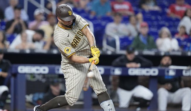 San Diego Padres&#x27; Gary Sanchez hits a home run during the fifth inning of a baseball game against the Miami Marlins, Thursday, June 1, 2023, in Miami. (AP Photo/Wilfredo Lee)