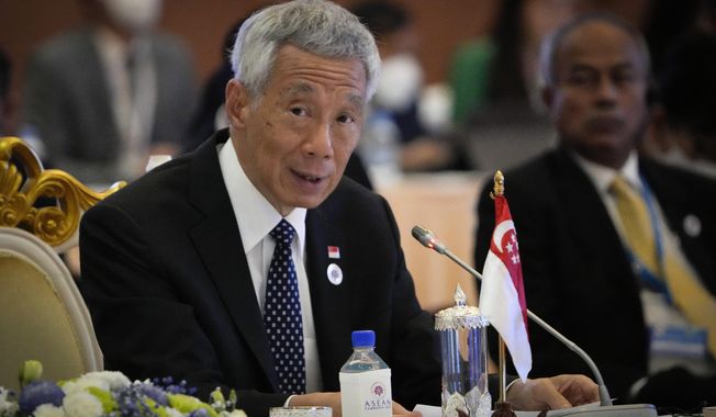 Singapore&#x27;s Prime Minister Lee Hsien Loong speaks during ASEAN - India Summits in Phnom Penh, Cambodia, on Nov. 12, 2022. Lee said Thursday, June 1, 2023 that he tested positive for COVID-19 for a second time in less than two weeks, in a rare case of a rebound.(AP Photo/Anupam Nath, File)