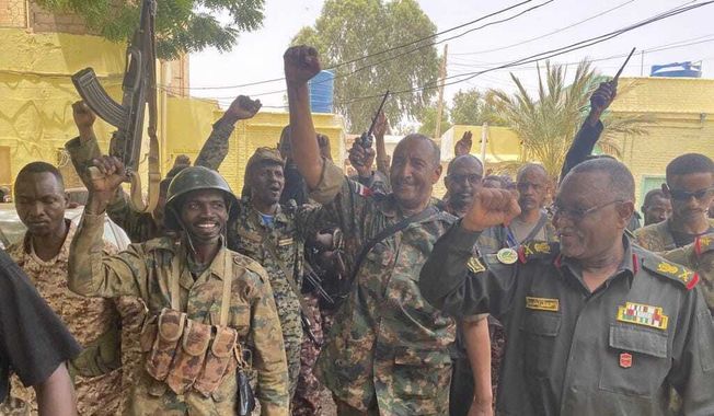 In this photo released by the Sudanese Army on Tuesday, May 30, 2023, Gen. Abdel-Fattah Burhan visits the troops in Khartoum, Sudan. (Sudanese Army via AP)