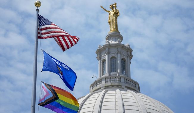 The Pride Flag flies at the Wisconsin State Capitol, Thursday, June 1, 2023, in Madison, Wis. (AP Photo/Morry Gash)