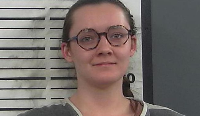 This booking photo provided by the Platte County Sheriff&#x27;s Office shows Lorna Roxanne Green on March 23, 2023 in Wheatland, Wyo. The college student who authorities say admitted setting fire to a building being turned into Wyoming&#x27;s only full-service abortion clinic is set to appear in federal court Friday, June 2, to enter a plea to an arson charge. (Platte County Sheriff&#x27;s Office via AP, File)