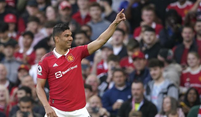 Manchester United&#x27;s Casemiro celebrates after scoring his side&#x27;s opening goal during the English Premier League soccer match between Manchester United and Chelsea at the Old Trafford stadium in Manchester, England, Thursday, May 25, 2023. (AP Photo/Dave Thompson)