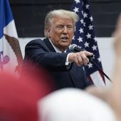 Former President Donald Trump visits with campaign volunteers at the Grimes Community Complex Park, Thursday, June 1, 2023, in Des Moines, Iowa. (AP Photo/Charlie Neibergall) ** FILE **