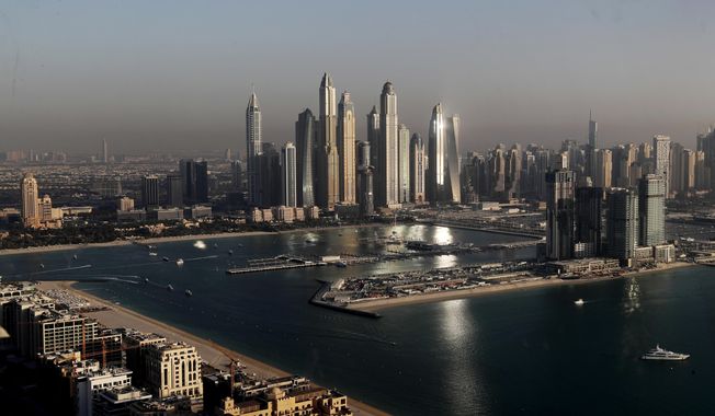 Luxury towers that dominate the skyline in the Dubai Marina district, center, and the new Dubai Harbor development, right, are seen from the observation deck of &quot;The View at The Palm Jumeirah&quot; in Dubai, United Arab Emirates, on April 6, 2021. A senior United Arab Emirates official says the Gulf nation wants a U.N. climate summit it’s hosting later this year to deliver “game-changing results” for international efforts to curb global warming. But UAE diplomat Majid al-Suwaidi said doing so will require having the fossil fuel industry at the table. (AP Photo/Kamran Jebreili, File)