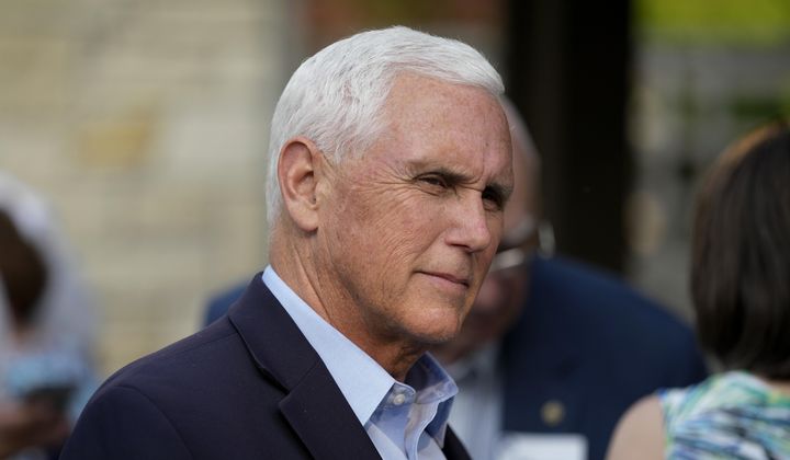 Former Vice President Mike Pence talks with local residents during a meet and greet on May 23, 2023, in Des Moines, Iowa. Pence will officially launch his widely expected campaign for the Republican nomination for president in Iowa on June 7. (AP Photo/Charlie Neibergall)