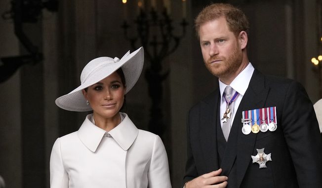 Prince Harry and Meghan Markle, Duke and Duchess of Sussex, leave after a service of thanksgiving for the reign of Queen Elizabeth II at St Paul&#x27;s Cathedral in London, Friday, June 3, 2022. The Duke of Sussex is scheduled to testify in the High Court after his lawyer presents opening statements Monday, June 5, 2023, in his case alleging phone hacking. It’s the first of Harry’s several legal cases against the media to go to trial and one of three alleging tabloid publishers unlawfully snooped on him. (AP Photo/Matt Dunham, Pool, File)
