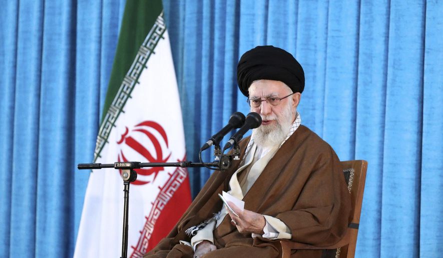 In this picture released by the official website of the office of the Iranian supreme leader, Supreme Leader Ayatollah Ali Khamenei speaks during a ceremony commemorating the death anniversary of the late revolutionary founder Ayatollah Khomeini at his mausoleum just outside Tehran, Iran, Sunday, June 4, 2023. (Office of the Iranian Supreme Leader via AP)