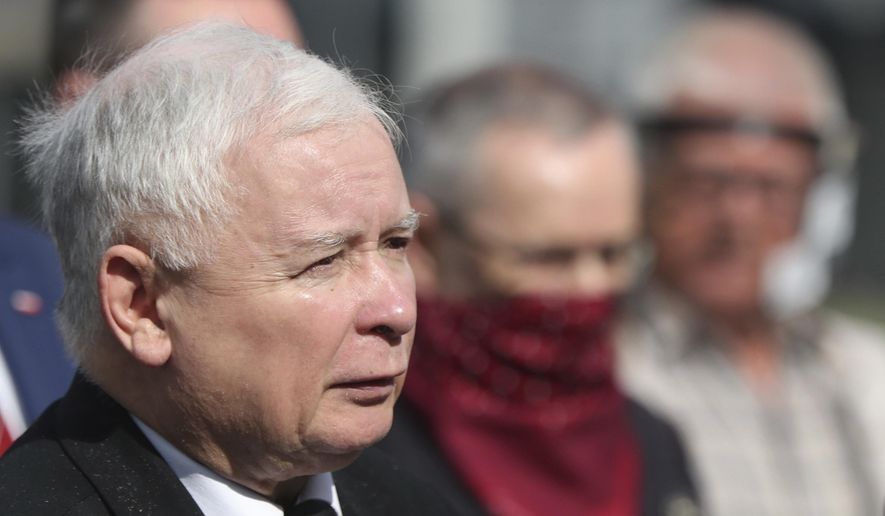 Poland's ruling party leader Jaroslaw Kaczynski, foreground, looks on during a police-guarded ceremony in Warsaw, Poland, July 10, 2020. Poland's largest opposition party is leading a march Sunday, June 4, 2023, which is meant to mobilize voters against the right-wing government which it accuses of eroding Poland's democracy and following Hungary and Turkey down an autocratic path. (AP Photo/Czarek Sokolowski, File)