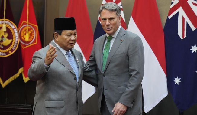 Australia&#x27;s Deputy Prime Minister and Defense Minister Richard Marles, right, talks with Indonesian Defense Minister Prabowo Subianto during their meeting in Jakarta, Indonesia, Monday, June 5, 2023. (AP Photo/Dita Alangkara)
