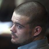 Joran van der Sloot looks back from his seat after entering the courtroom for the continuation of his murder trial at San Pedro prison in Lima, Peru, Jan. 11, 2012. The Peruvian government said on Monday, June 5, 2023, that Van der Sloot, the main suspect in the unsolved 2005 disappearance of American student Natalee Holloway, will be extradited this week to the United States. (AP Photo/Karel Navarro, File)