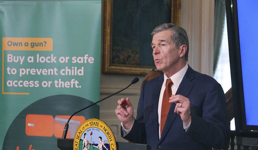North Carolina Gov. Roy Cooper announces a new campaign promoting the safe storage of firearms, Monday, June 5, 2023, at the Executive Mansion in Raleigh, N.C. (AP Photo/Hannah Schoenbaum)