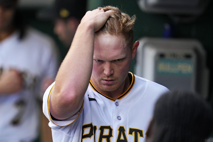 Pittsburgh Pirates starting pitcher Mitch Keller walks in the dugout after pitching in the top of the first inning of a baseball game against the Oakland Athletics in Pittsburgh, Tuesday, June 6, 2023. (AP Photo/Gene J. Puskar)