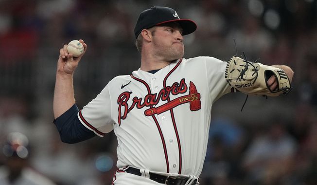 Atlanta Braves starting pitcher Bryce Elder (55) delivers in the first inning of a baseball game against the New York Mets Tuesday, June 6, 2023, in Atlanta. (AP Photo/John Bazemore)