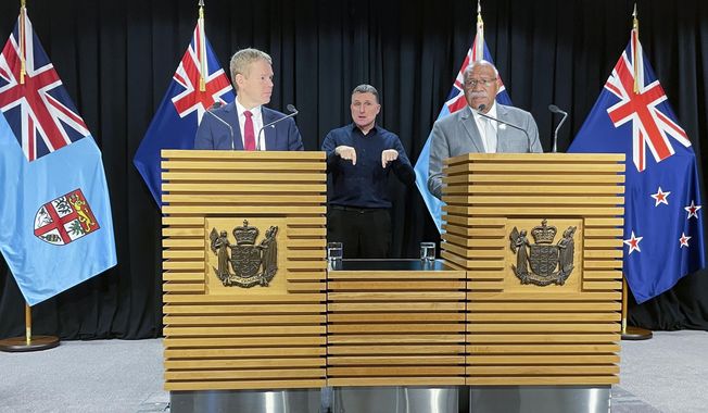Fiji Prime Minister Sitiveni Rabuka, right, and New Zealand Prime Minister Chris Hipkins answer questions at a media conference in Wellington, New Zealand, Wednesday, June 7, 2023. Rabuka indicated his nation is reconsidering its security ties with China at a time that geopolitical tensions in the Pacific are rising. (AP Photo/Nick Perry)