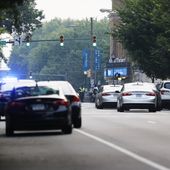 Cars and police gather around Altria Theater, the site of a shooting at the Huguenot High School graduation, Tuesday, June 6, 2023, in Richmond, Va. (Mike Kropf/Richmond Times-Dispatch via AP)