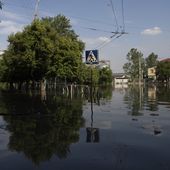Streets are flooded in Kherson, Ukraine, Tuesday, Jun 6, 2023 after the Kakhovka dam was blown up overnight. The wall of a major dam in a part of southern Ukraine has collapsed, triggering floods, endangering Europe&#x27;s largest nuclear power plant and threatening drinking water supplies. (AP Photo/Evgeniy Maloletka)