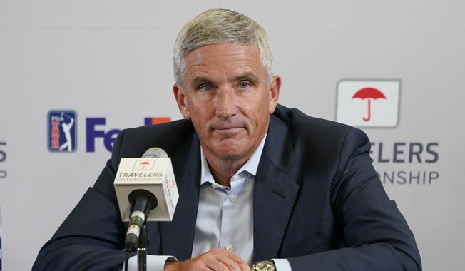 PGA Tour Commissioner Jay Monahan speaks during a news conference before the start of the Travelers Championship golf tournament at TPC River Highlands, Wednesday, June 22, 2022, in Cromwell, Conn. The most disruptive year in golf ended Tuesday, June 6, 2023, when the PGA Tour and European tour agreed to a merger with Saudi Arabia&#x27;s golf interests, creating a commercial operation designed to unify professional golf around the world.(AP Photo/Seth Wenig, File) **FILE**