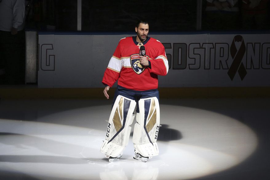 FILE - Florida Panthers goaltender Roberto Luongo (1) talks to fans about the shooting at Marjory Stoneman Douglas High School, prior to an NHL hockey game against the Washington Capitals, in Sunrise, Fla.. Feb. 22, 2018. The Vegas Golden Knights and Florida Panthers were connected by tragedy just over five years ago. Within months of each other, Las Vegas and South Florida were devastated by mass shootings not far from their arenas — and the then-expansion Knights and the Panthers played major roles in the healing that has followed. (AP Photo/Joel Auerbach, File)