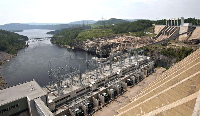 A dam generates power along the Manicouagan River north of Baie-Comeau, Quebec, June 22, 2010. Importing more of Canada&#x27;s historically abundant hydroelectricity is seen by some as a key component to making the U.S. electric grid carbon-free by 2035, as well as improving energy reliability and cost for American consumers. (Jacques Boissinot/The Canadian Press via AP, File)