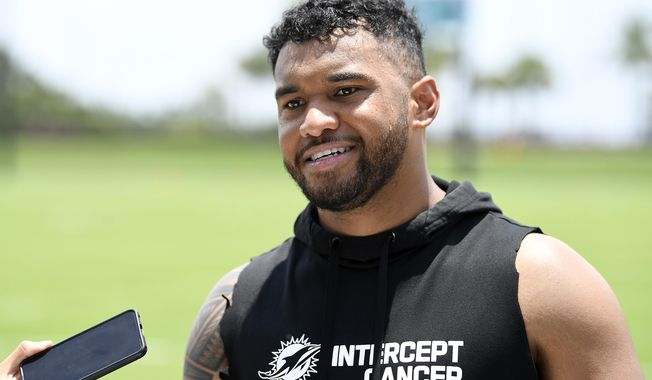 Miami Dolphins quarterback Tua Tagovailoa speaks to the news media after practice at the NFL football team&#x27;s training facility, Wednesday, June 7, 2023, in Miami Gardens, Fla. (AP Photo/Michael Laughlin)